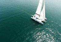 trimaran sailing sun bathing on deck